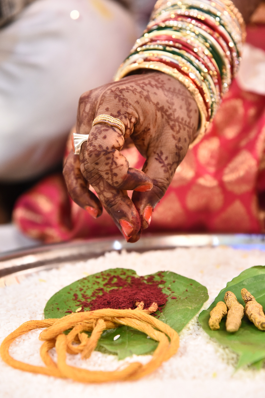 Unposed look between bride and groom during ceremony